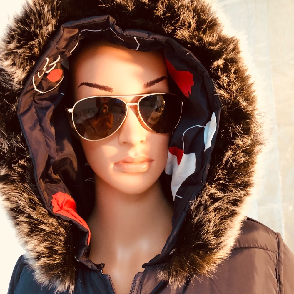 Navy blue quilted winter jacket with fur hoodie.